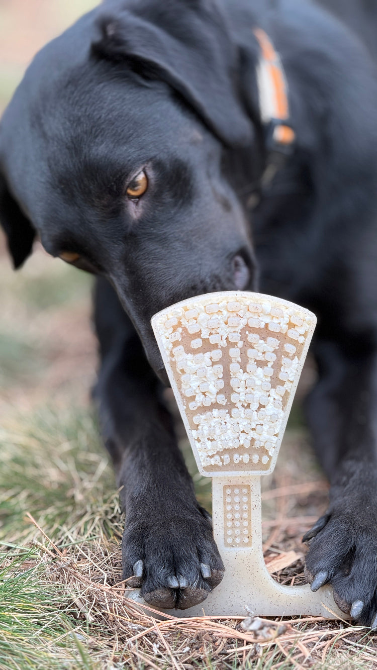 Waffle Tower Nylon Chew Toy — Waffle Tower nylon toy shown in use with a filling; food is not included.