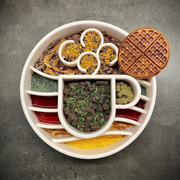 Java Slow Feeder Bowl — Speckled Java bowl shown with a serving; food and other items are not included.